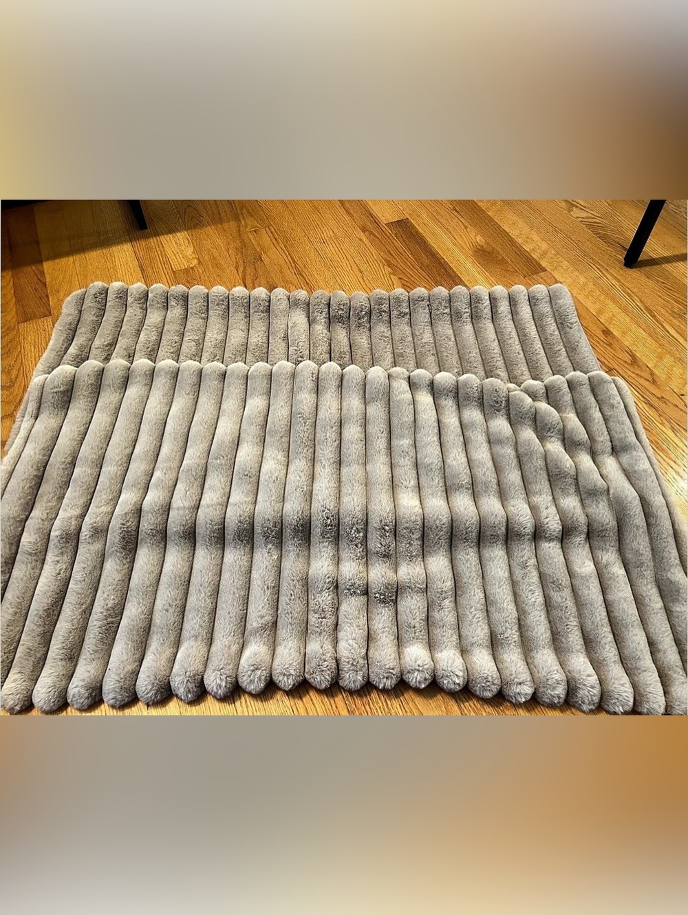 pair of ribbed faux fur pillow shams in a light taupe